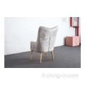 Chaise de loisirs armé en tissu de velours gris boutonné